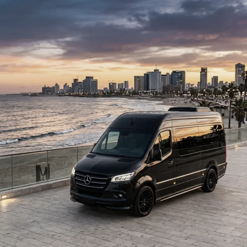 A black Mercedes-Benz Sprinter from the RT Tours fleet.