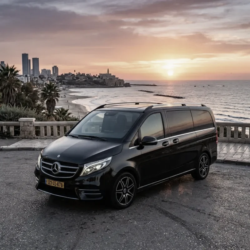 A black Mercedes-Benz V-Class van from the RT Tours fleet.
